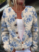 Women's cream cardigan with blue floral print and front buttons