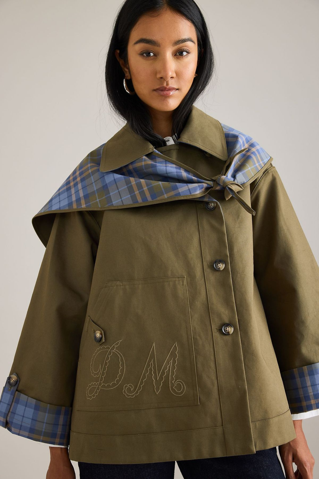 Women's olive utility jacket with blue plaid panels and long sleeves