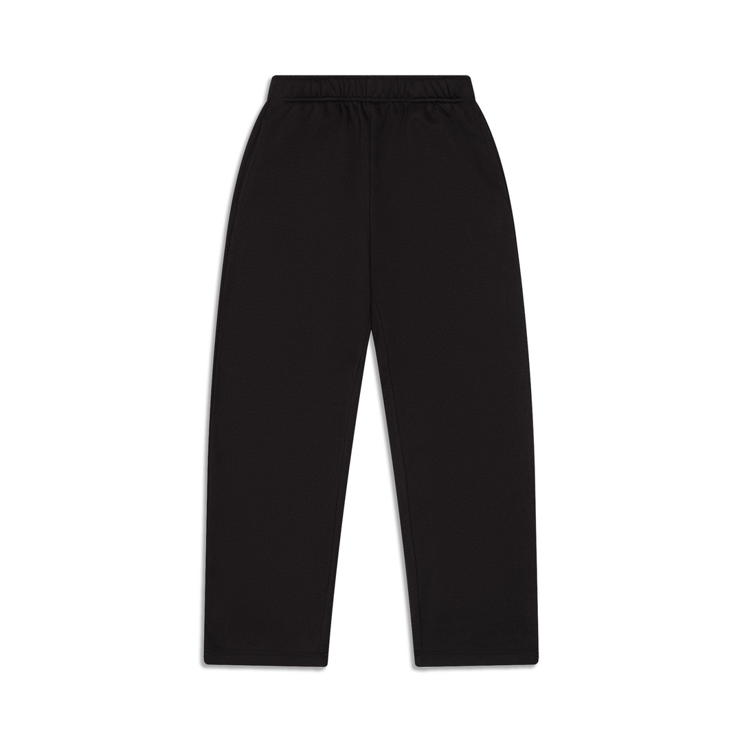 Man wearing black wide-leg sweatpants with an elastic waistband and side pockets