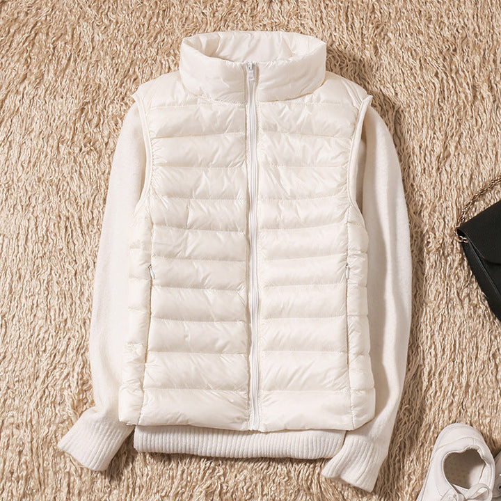 Women's quilted puffer vest with high collar and zipper