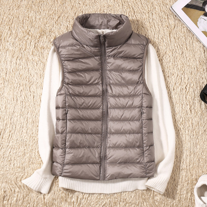 Women's quilted puffer vest with high collar and zipper