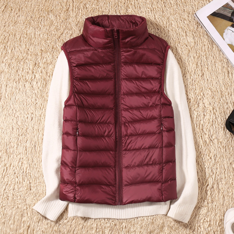 Women's quilted puffer vest with high collar and zipper