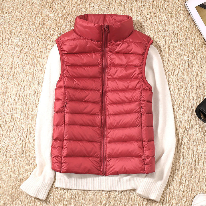 Women's quilted puffer vest with high collar and zipper