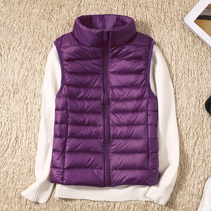 Women's quilted puffer vest with high collar and zipper