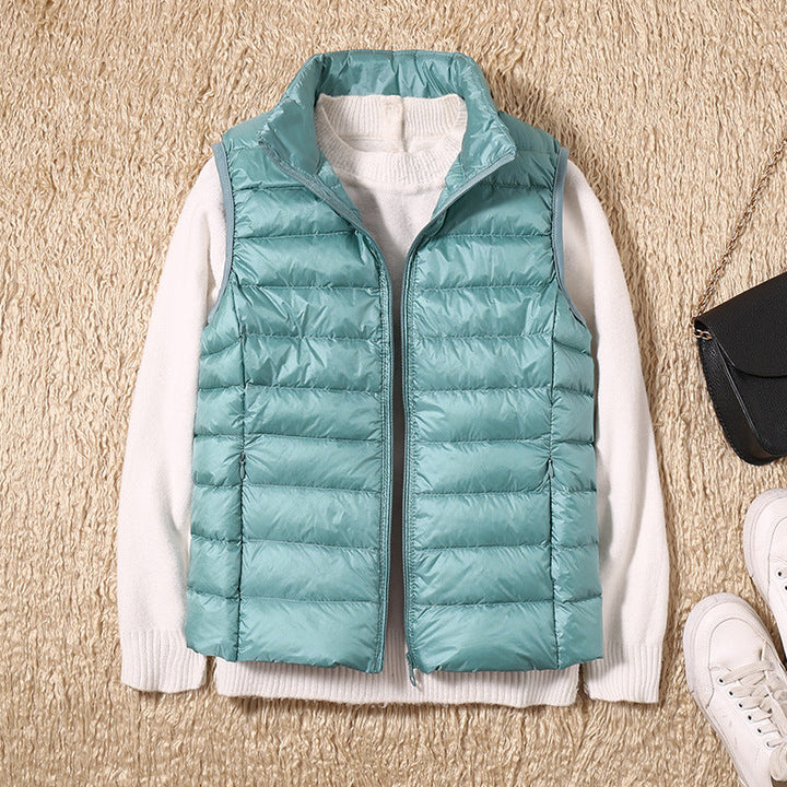 Women's quilted puffer vest with high collar and zipper