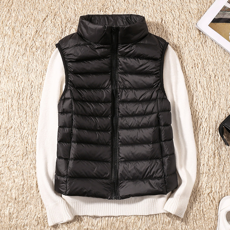 Women's quilted puffer vest with high collar and zipper