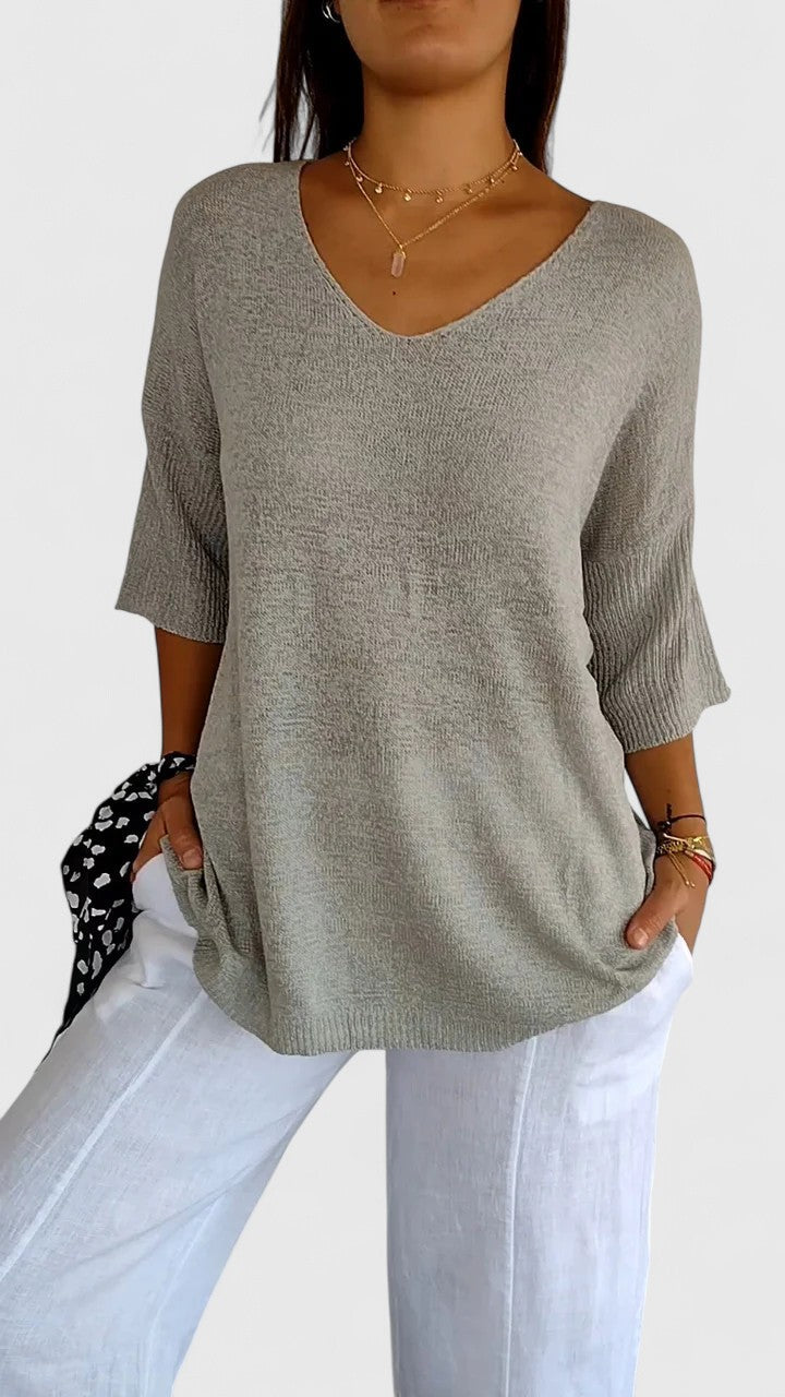Women's textured V-neck sweater with three-quarter sleeves