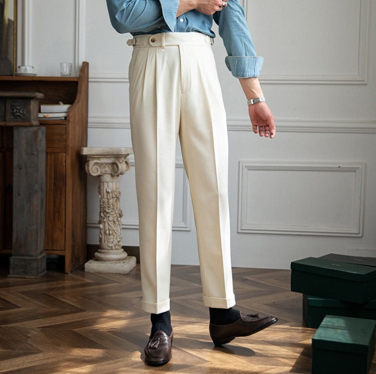 Pleated trousers with side waist tabs, belt loops and cuffed hems