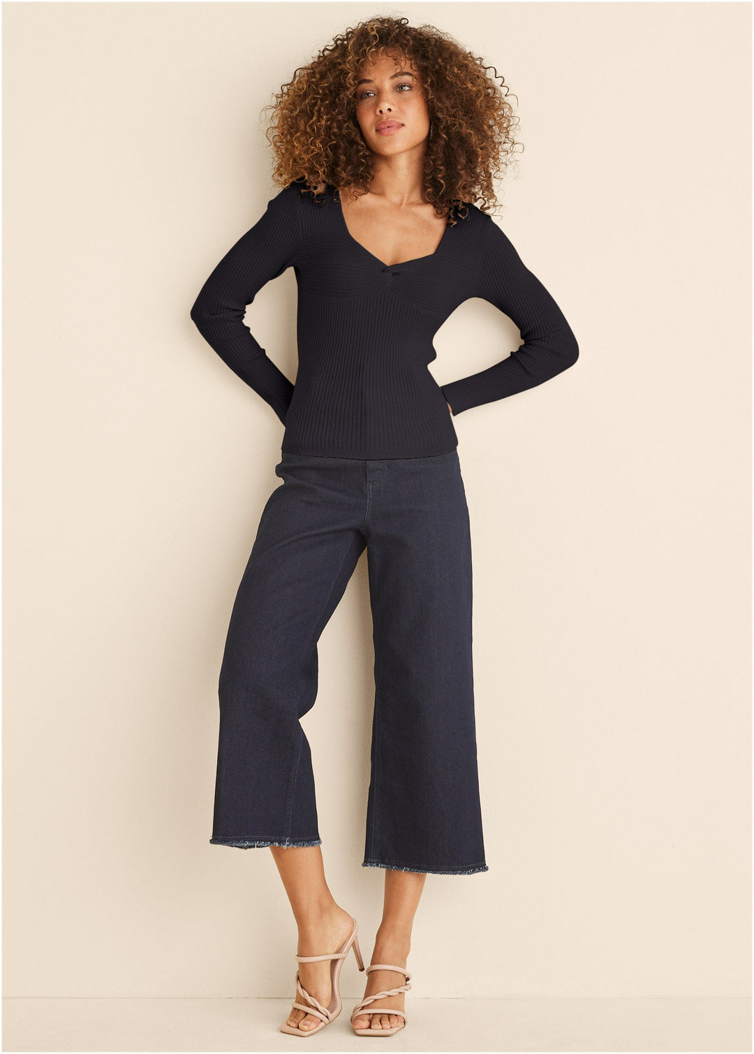 Women's black ribbed top with twist front and long sleeves