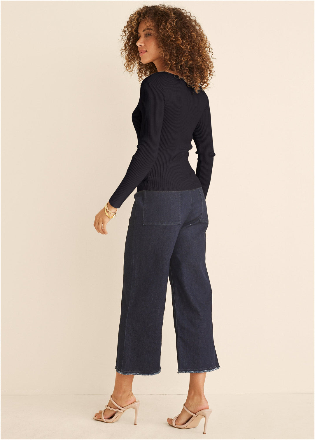 Women's black ribbed top with twist front and long sleeves