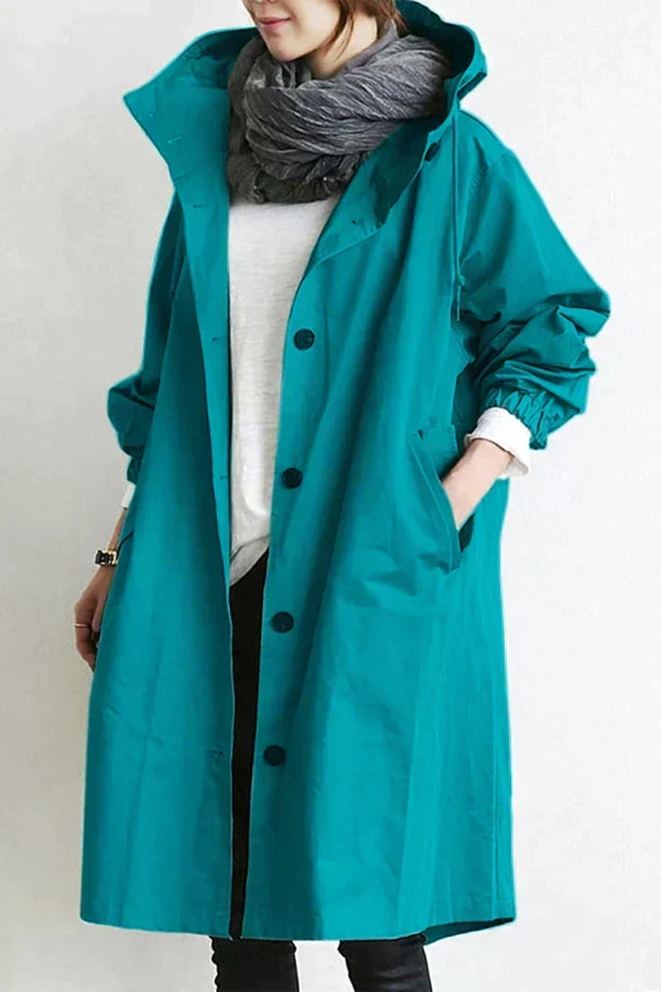 Women's oversized hooded mid-length trench coat with button front and side pockets