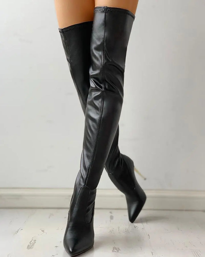 Black over the knee boots with gold-tone zippers and high stiletto heels