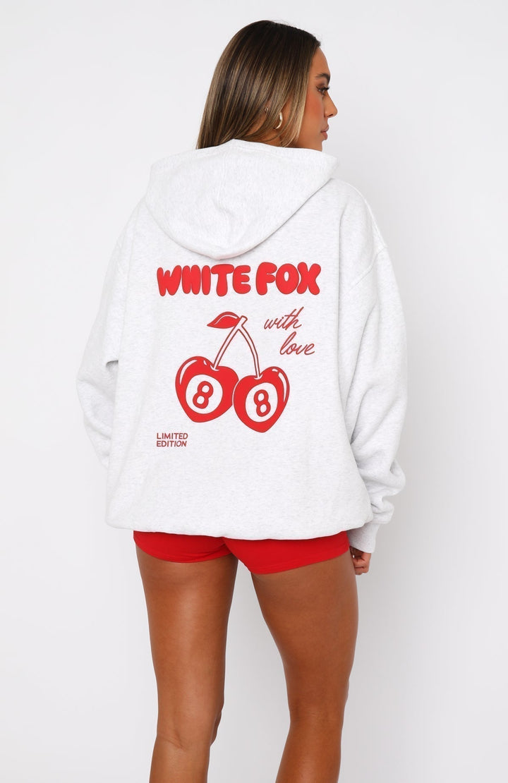 Women's oversized white hoodie with red White Fox graphic and hood