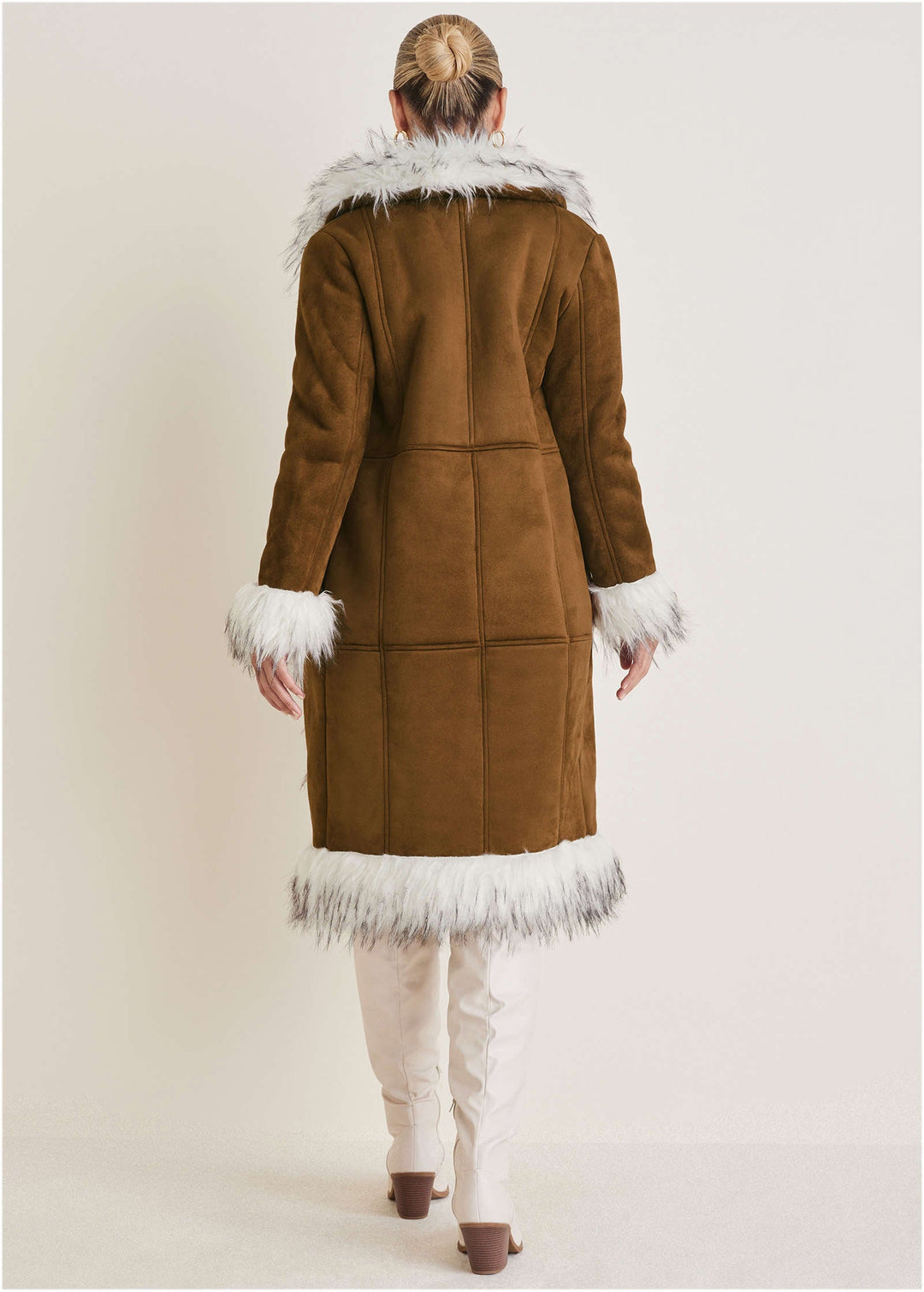 Women's long brown coat with light fluffy trim, long sleeves and lower front pockets