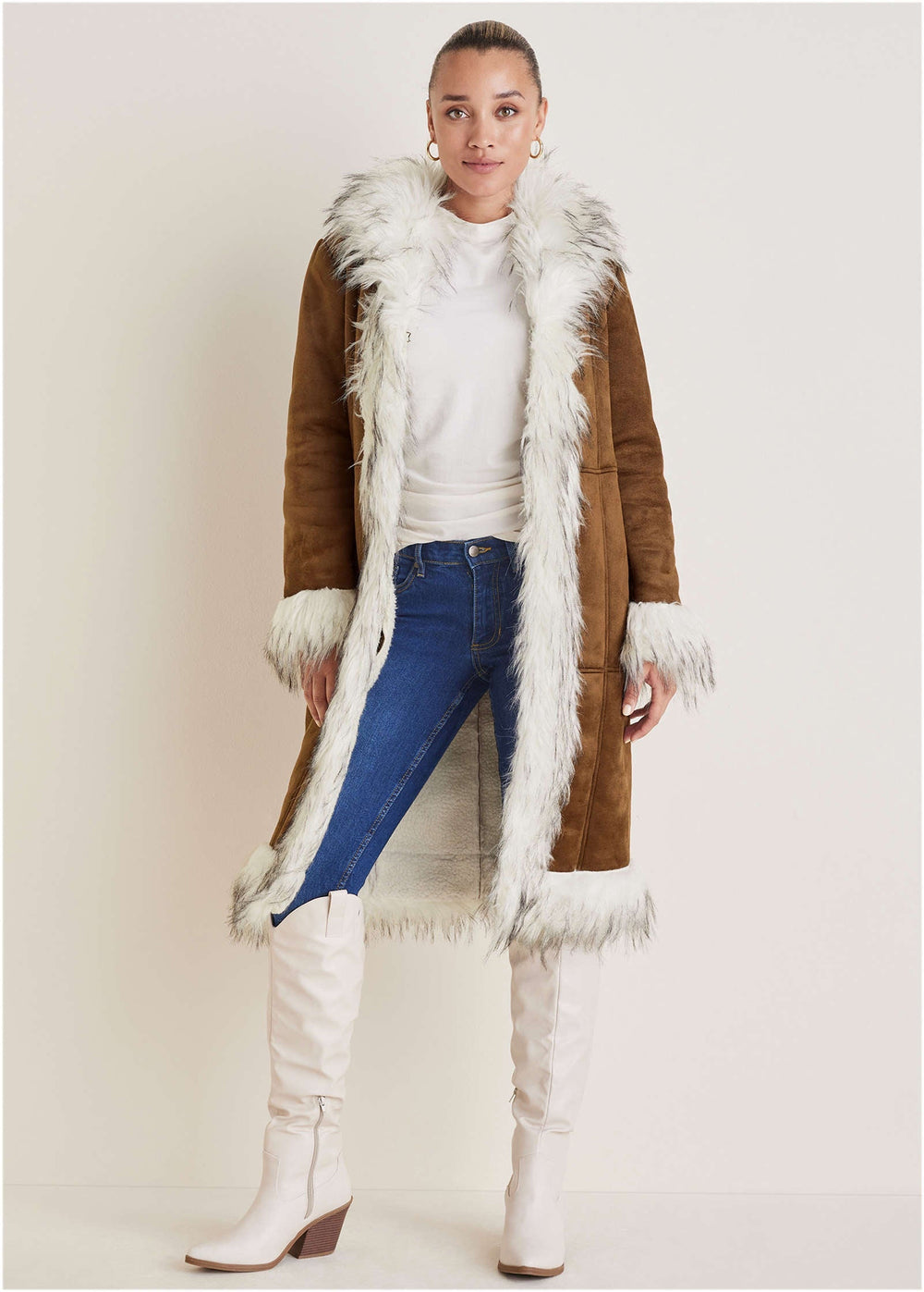 Women's long brown coat with light fluffy trim, long sleeves and lower front pockets