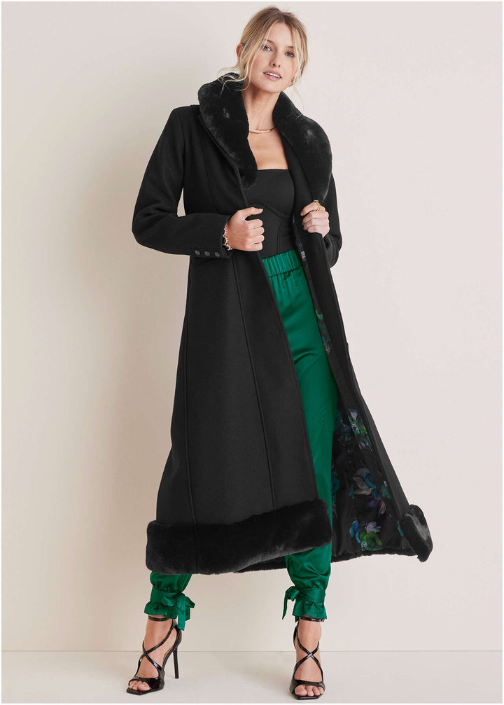 Women's black long coat with faux-fur collar and hem