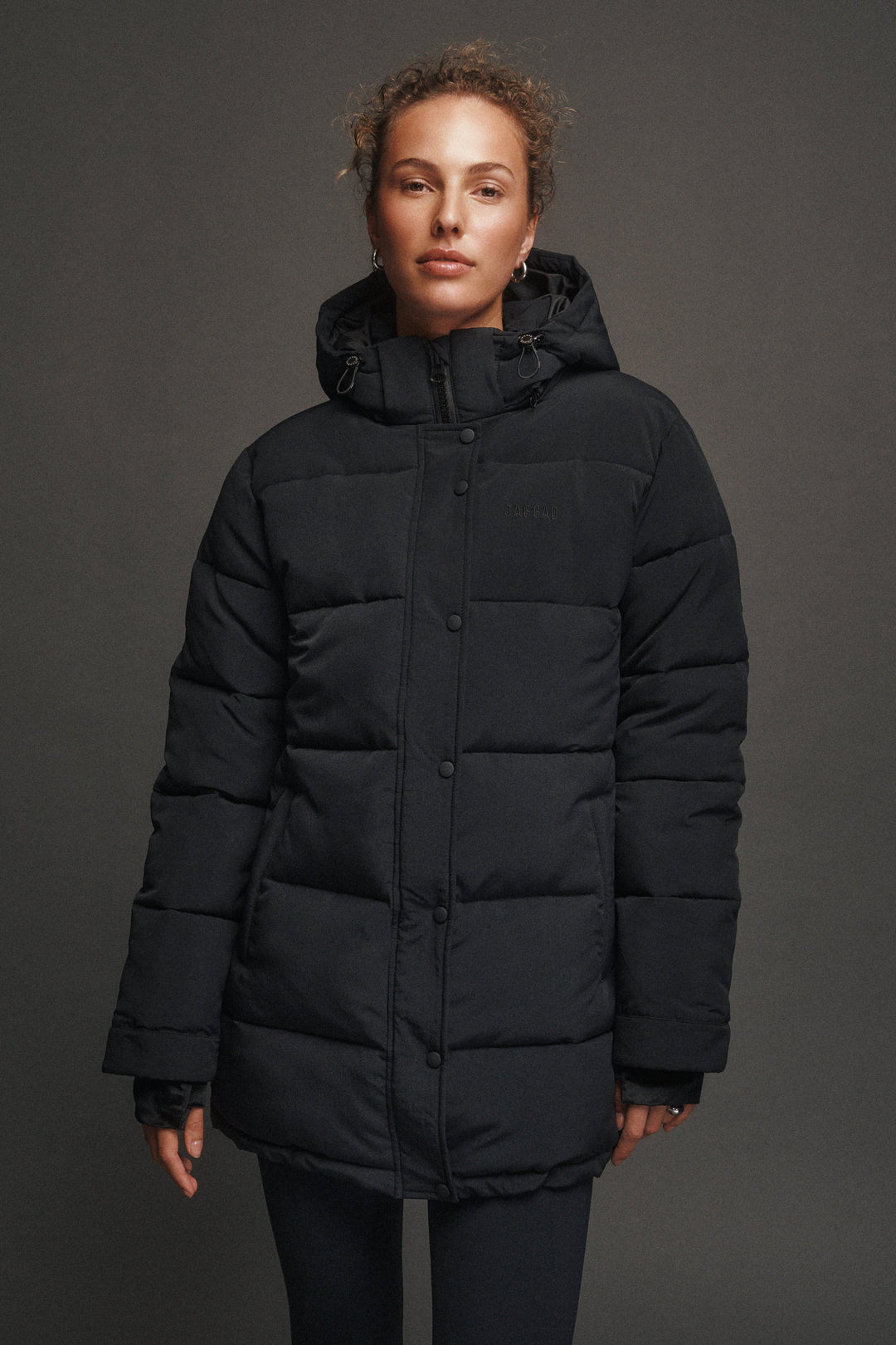 Black women's quilted hooded puffer jacket with long sleeves
