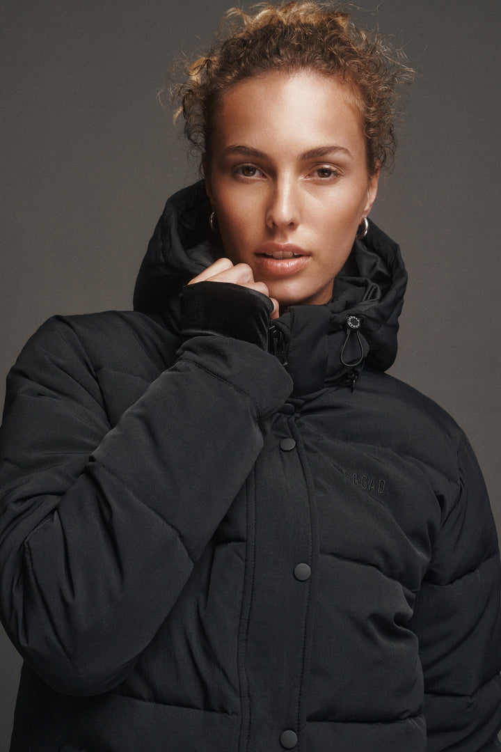 Black women's quilted hooded puffer jacket with long sleeves