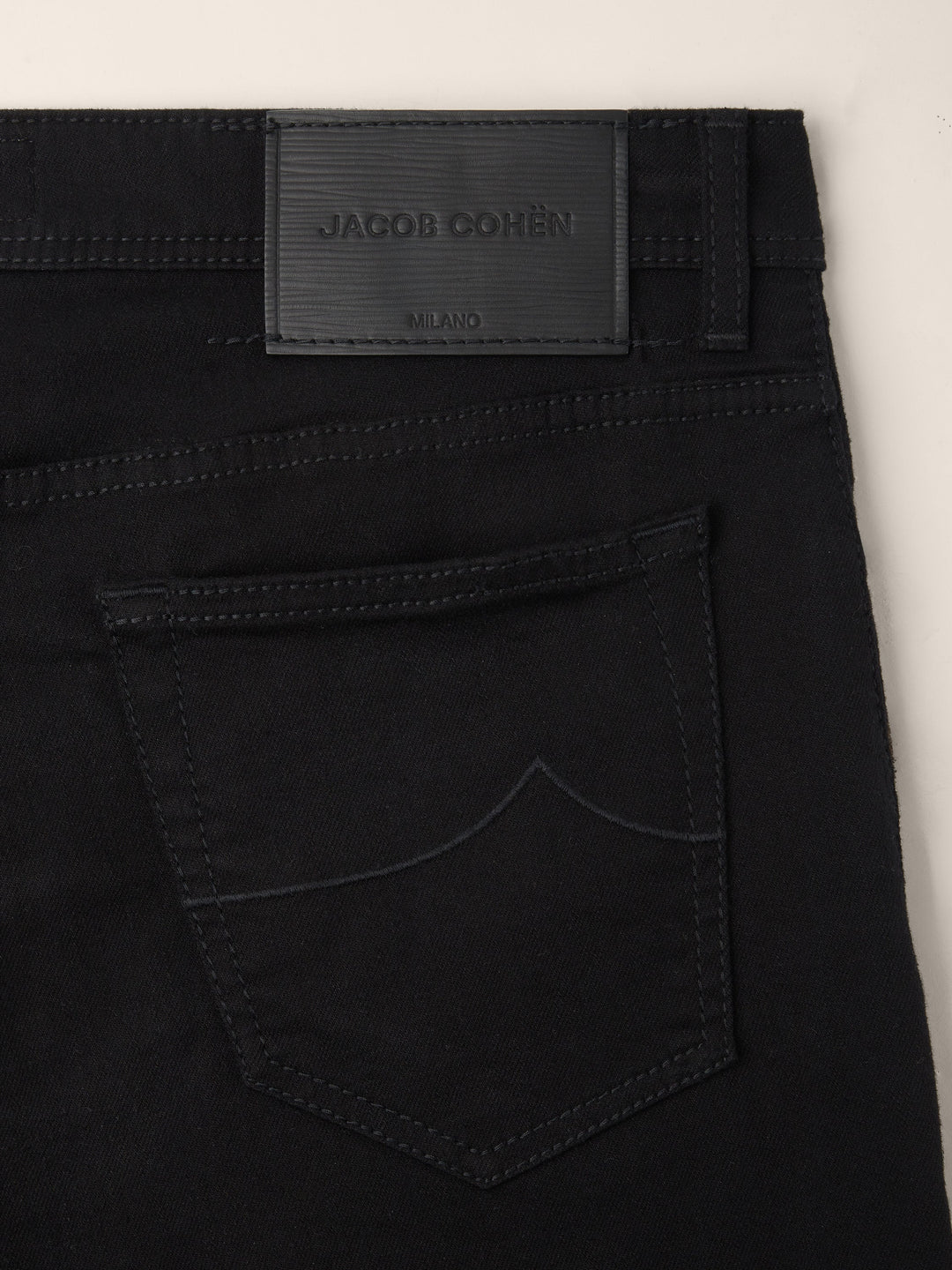 Men's black slim five-pocket jeans with button and zip fly
