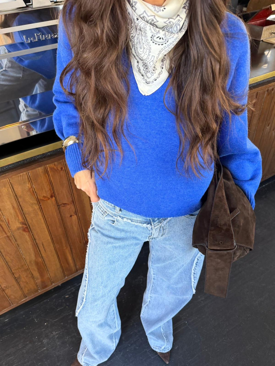 Women's blue long-sleeve V-neck knit sweater with ribbed trims