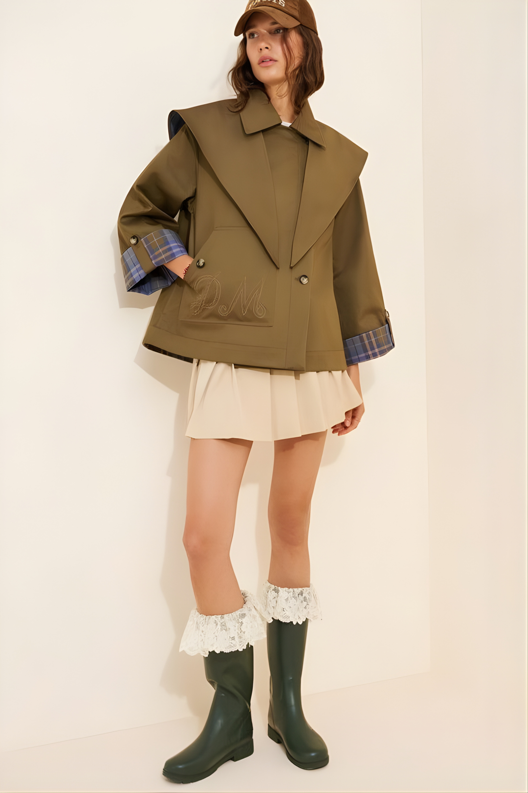 Women's olive utility jacket with blue plaid panels and long sleeves