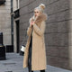 Women's long padded hooded coat with faux fur trim