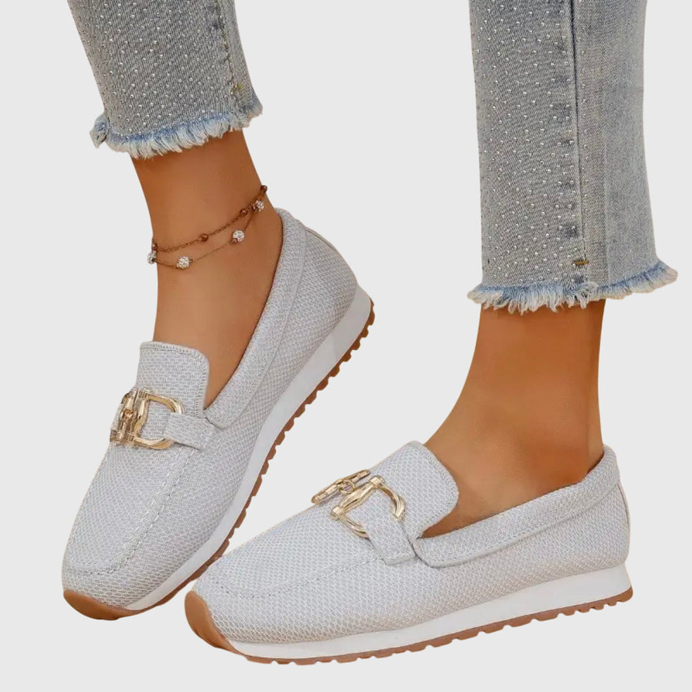 Women's loafer sneakers with metal bar detail and flat textured sole