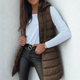 Women's long sleeveless hooded quilted puffer vest with zip front