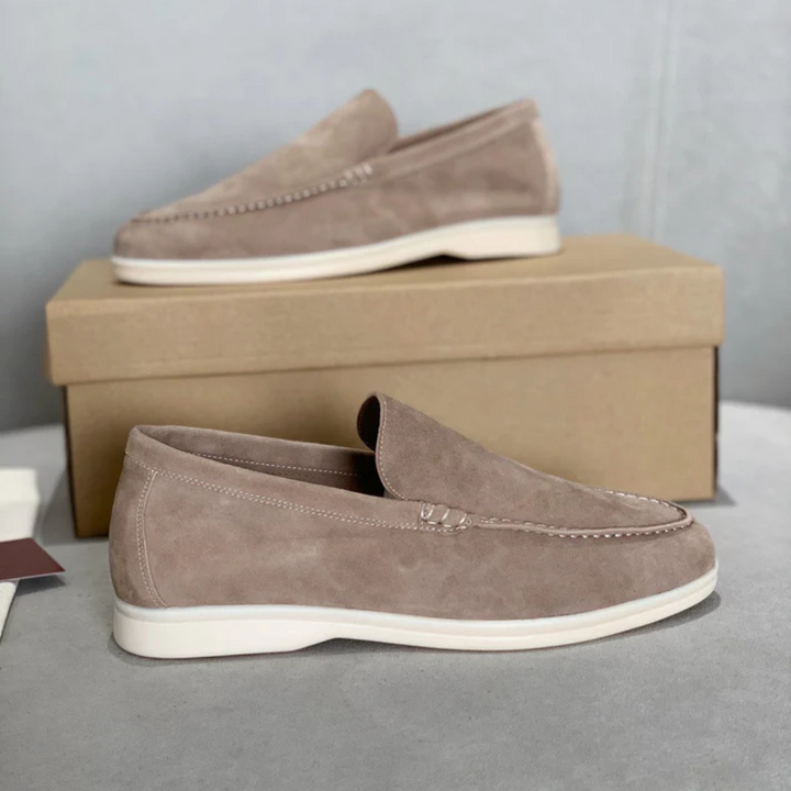 Slip-on loafers with moc-toe stitching and flat contrasting soles