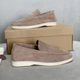 Slip-on loafers with moc-toe stitching and flat contrasting soles