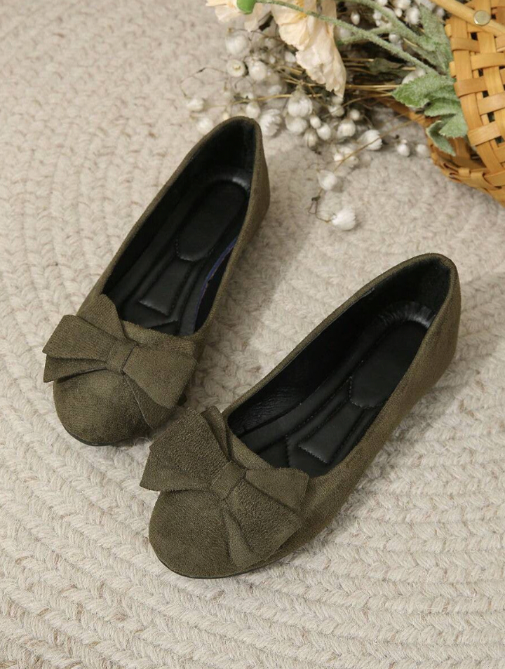 Bow detail flat loafers shown in black and dark green