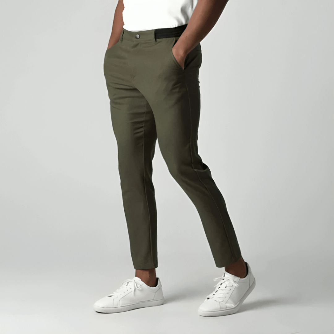 Men's slim tapered cropped chino pants shown in black and navy with side pockets and button closure