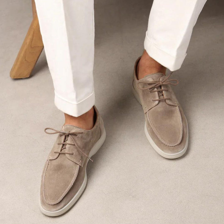Men's lace-up moc toe loafers shown in navy and beige colourways