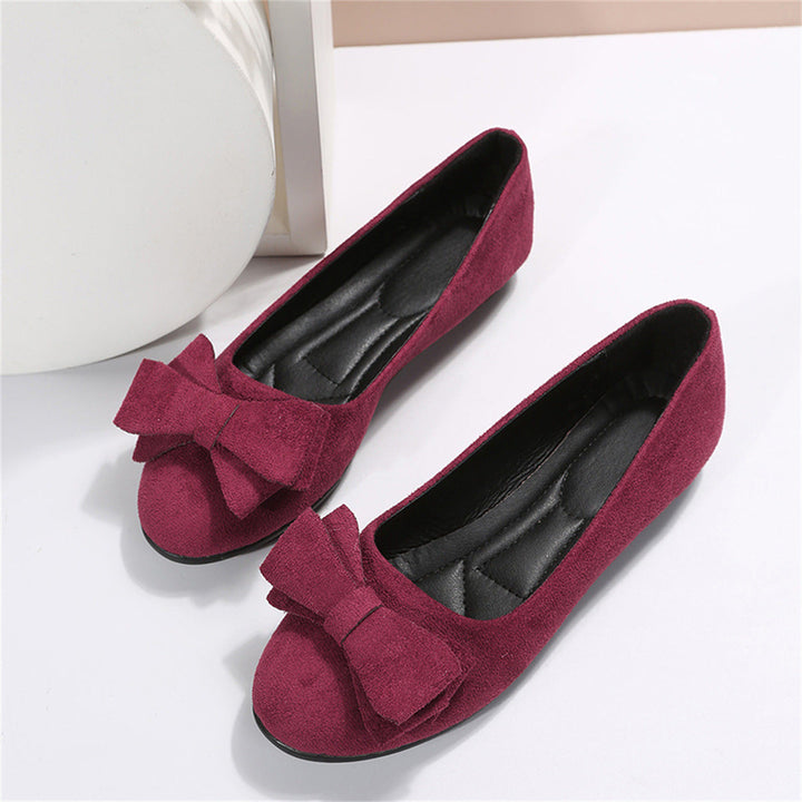 Bow detail flat loafers shown in black and dark green