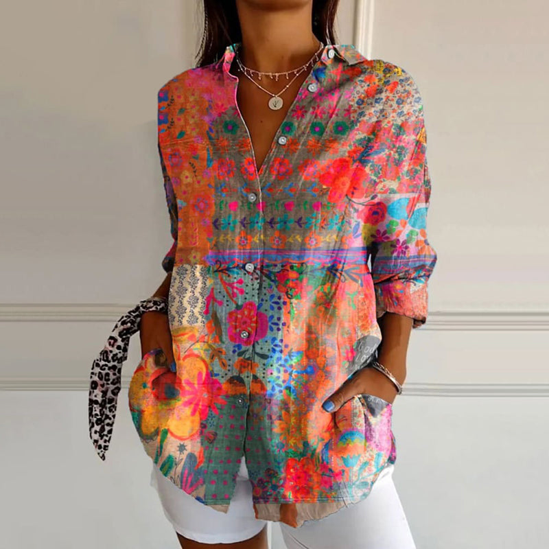 Woman wearing a bohemian floral print long-sleeve button-up blouse