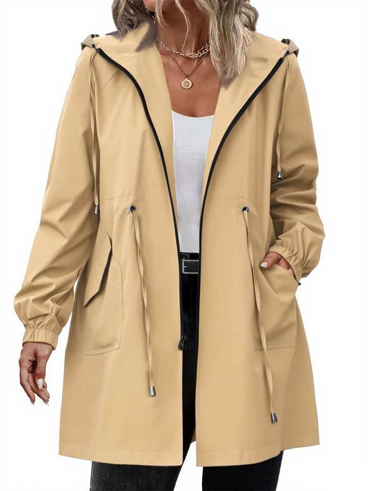 Women's longline hooded raincoat with drawstring waist