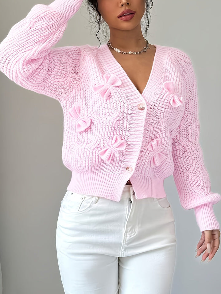 Women's ribbed V-neck cardigan with bow details and button front