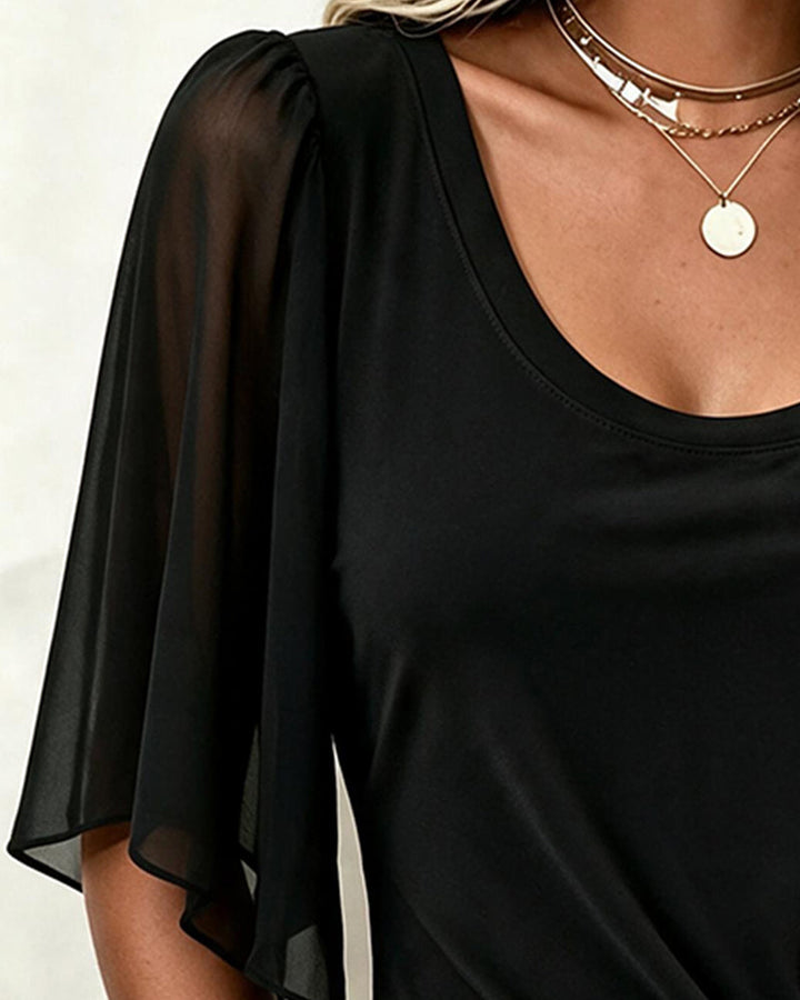 Women's black blouse with sheer 3/4 sleeves and gathered gold-tone ring waist detail