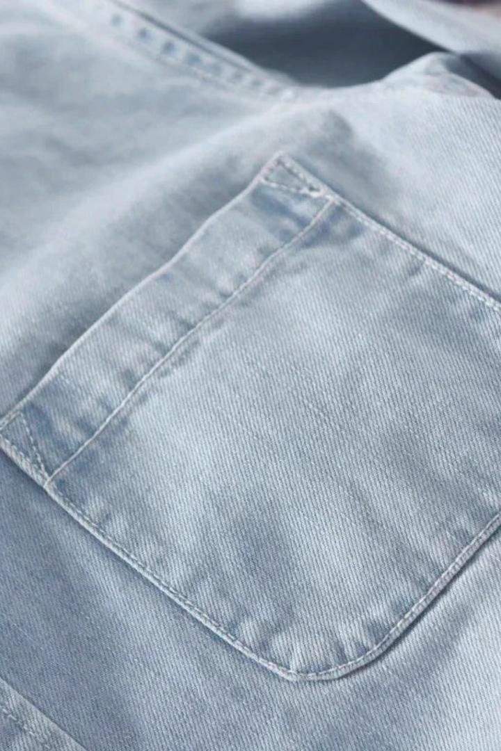 Men's button-down denim shirt with long sleeves and chest pocket