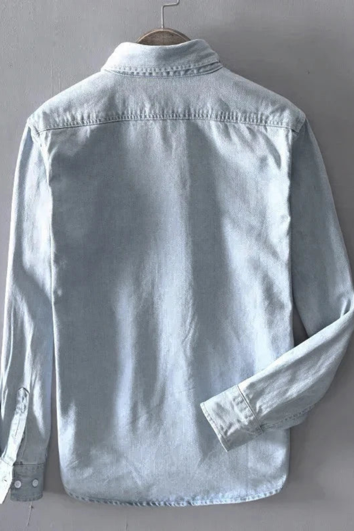 Men's button-down denim shirt with long sleeves and chest pocket