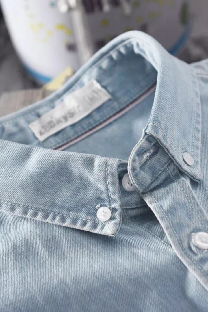 Men's button-down denim shirt with long sleeves and chest pocket