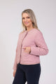 Women's pink quilted cropped jacket with round neck, buttons and front pockets