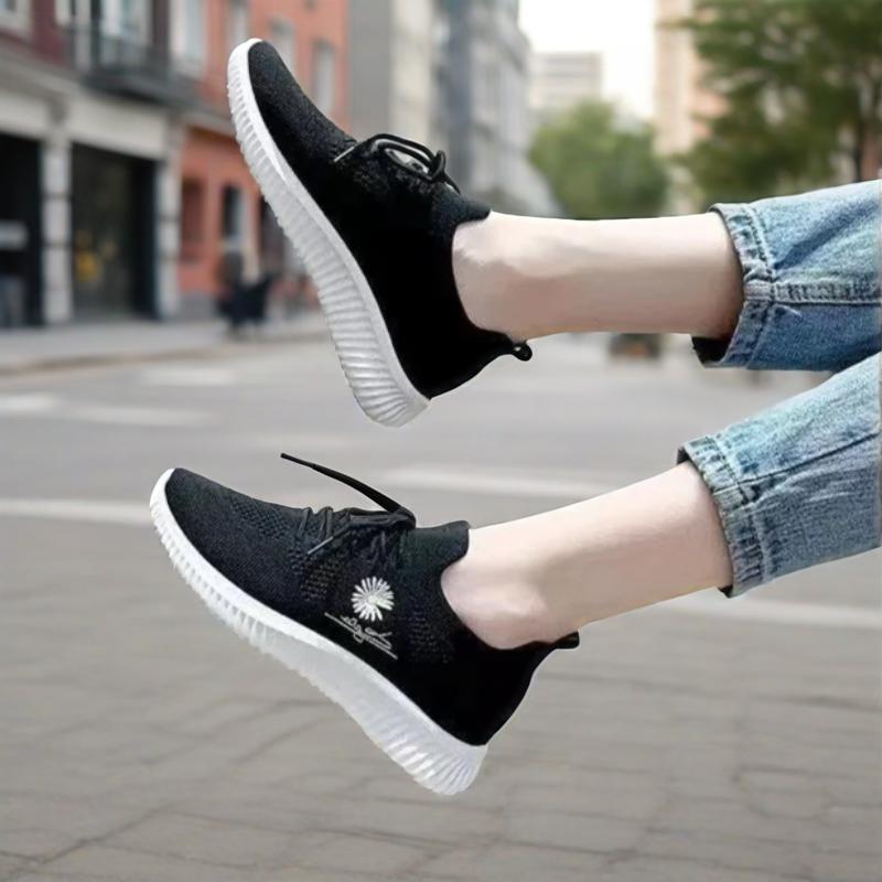 Women's textured lace-up sneakers with floral side detail and ridged soles