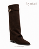 Women's brown knee-high boots with pointed toes, buckle straps and low block heels