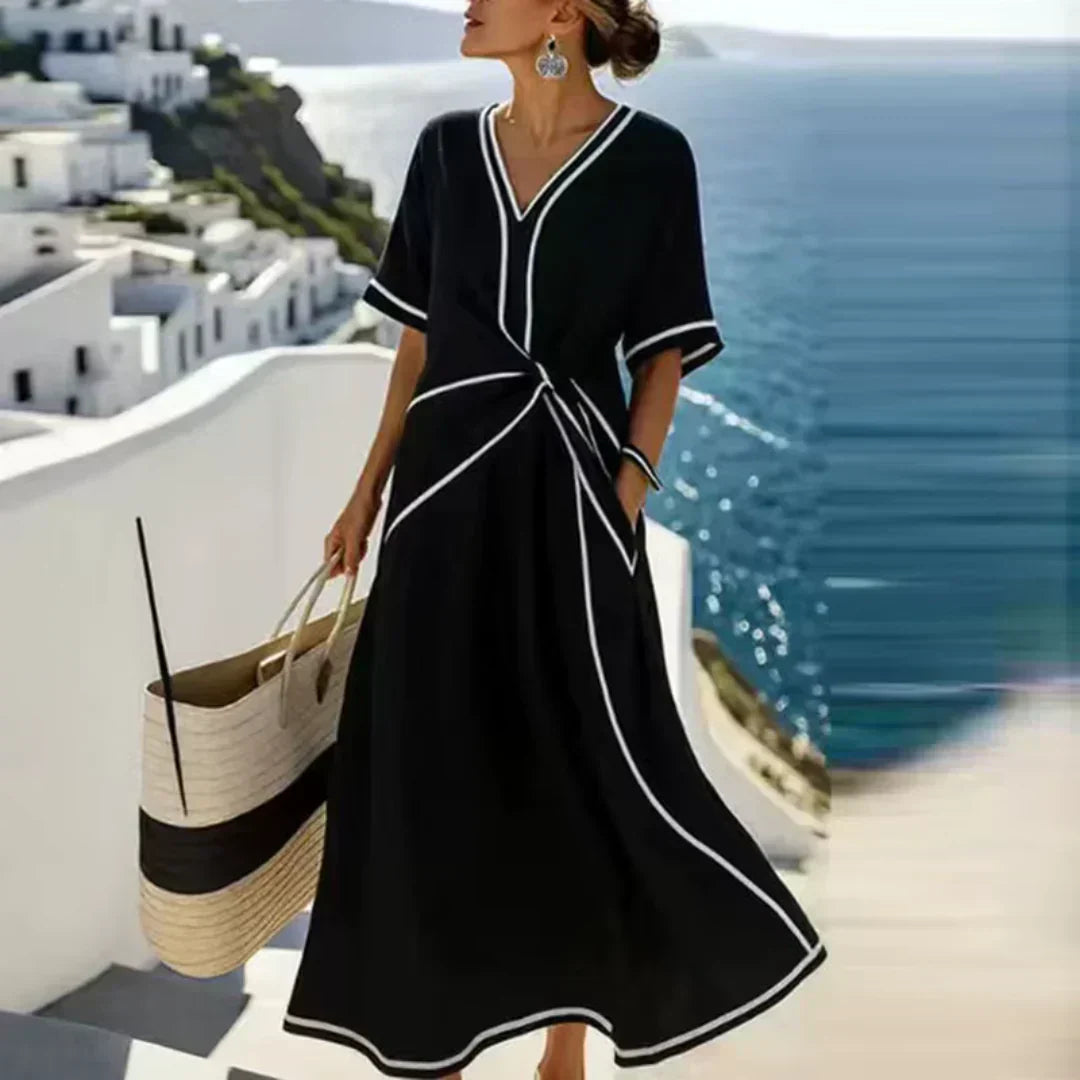 Women's wrap midi dress with V-neckline, short sleeves, and contrast trim in blue