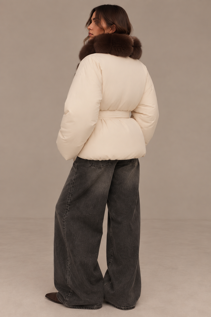 Women's puffer jacket with textured brown trim and front waist tie