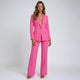 Women's tailored blazer and wide leg trousers set with long sleeves and flap pockets