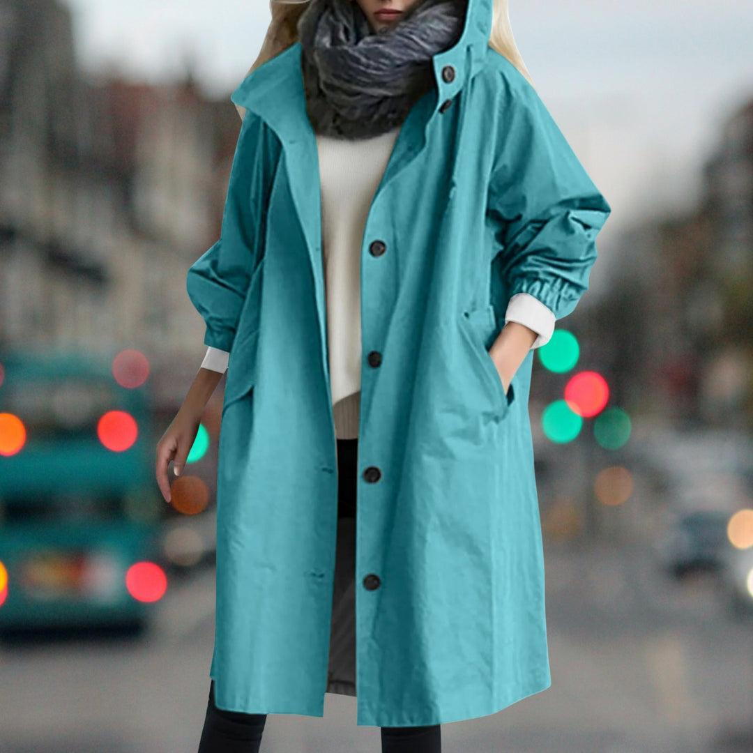 Women's hooded longline rain coat with button front and gathered cuffs