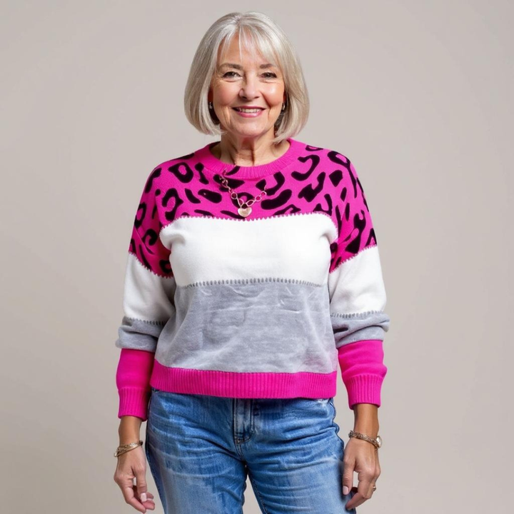 Women's leopard print color block sweater with crew neckline and long sleeves