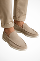 Men's slip-on loafers with rounded moc toe stitching and flat white soles